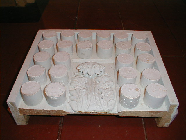 Guttae with threads attached for installation